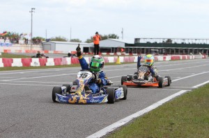 Australian Lochie Hughes makes a last lap last turn pass for the win in TaG Cadet (Photo: Studio52.us)