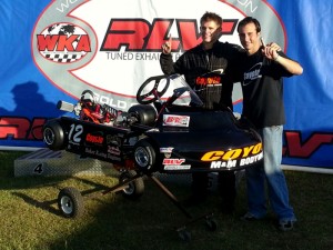 Dylan Zobkiw (left) celebrates his 2013 Senior Pro Gas Animal championship and new go-kart with Coyote's Jim Lipari (Photo: NCRM)