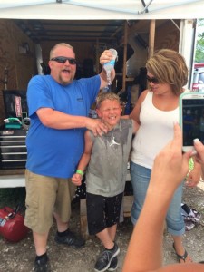 Eli Fox (center) gets a victory shower courtesy of dad Jamie and mom Morgan Fox at Brazil (IN) (Photo: Jamie Fox)