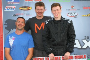 Luke and his father Garron Selliken along with Rolison Performance Group owner Mike Rolison receiving the Rotax Grand Finals 2015 ticket (Photo: SeanBuur.com)