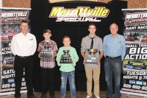 Merrittville Speedway’s Co-owners Randy Williamson and Pete Bicknell surround 2015 Performance Manufacturing Kart Champions (left to right) Dalton Slack (Ed MacPherson Construction Junior 2), Tucker Wood (RCM Racing Equipment Junior 1) and Dylan Culp (Wilder Racing Engines Senior Animal). Superior PetroFuels Junior Restricted Champion Joshua Hansen was unable to attend as he was racing in Georgia.