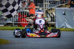 Spike Kohlbecker takes the checkered flag for a dominating win in Yamaha Junior at Daytona KartWeek