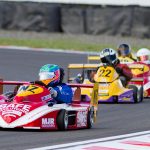 Wellington's Karl Wilson (#NZ) leading Paul Dunlop on his way to winning the 2014 New Zealand SuperKart Grand Prix at Taupo